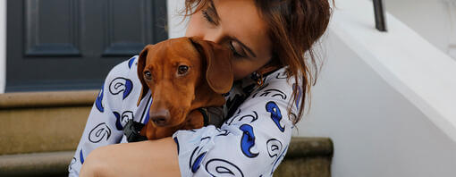 Woman hugging her dog